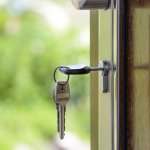 keys in a door in a home that's for sale