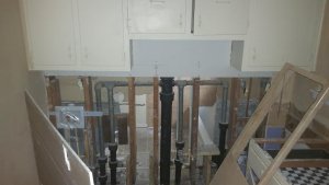 Pre-Reno kitchen to bath wall open
